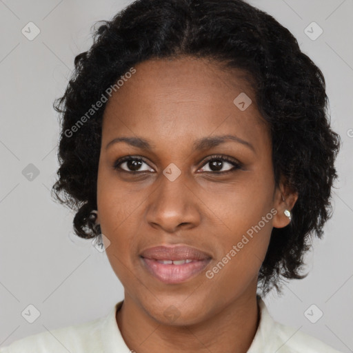 Joyful black adult female with medium  black hair and brown eyes