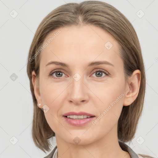 Joyful white young-adult female with medium  brown hair and grey eyes