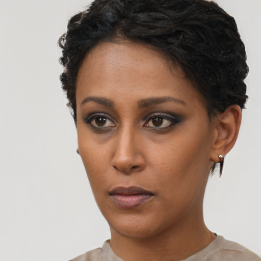 Neutral black young-adult female with short  black hair and brown eyes