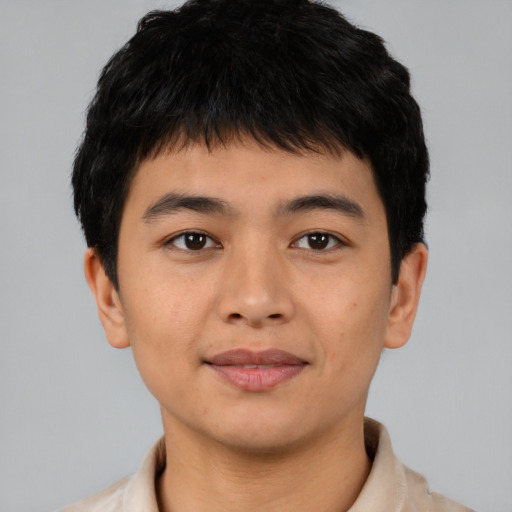 Joyful asian young-adult male with short  black hair and brown eyes