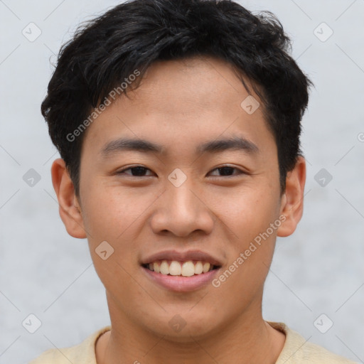 Joyful asian young-adult male with short  brown hair and brown eyes