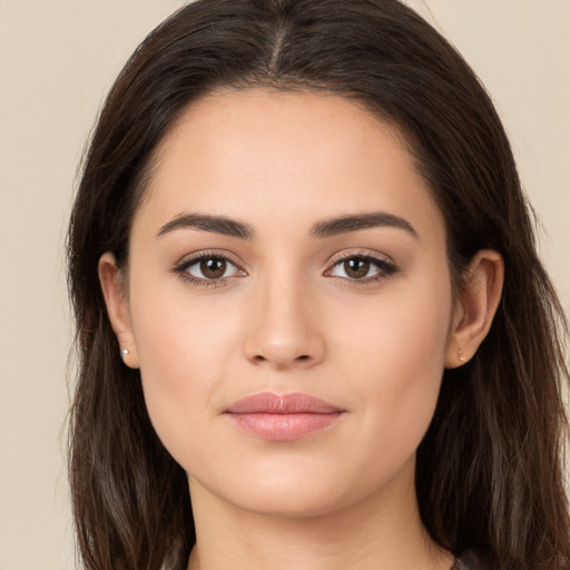 Joyful white young-adult female with long  brown hair and brown eyes