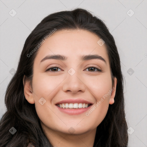 Joyful white young-adult female with long  black hair and brown eyes