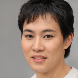 Joyful asian young-adult female with short  brown hair and brown eyes