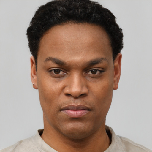 Neutral black young-adult male with short  black hair and brown eyes