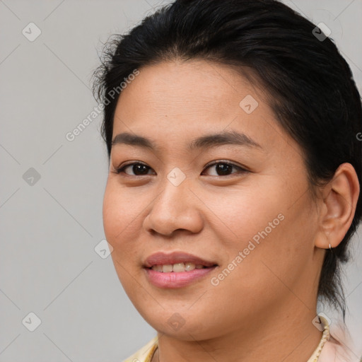 Joyful asian young-adult female with medium  brown hair and brown eyes