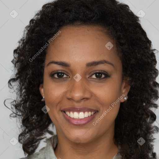 Joyful black young-adult female with long  brown hair and brown eyes