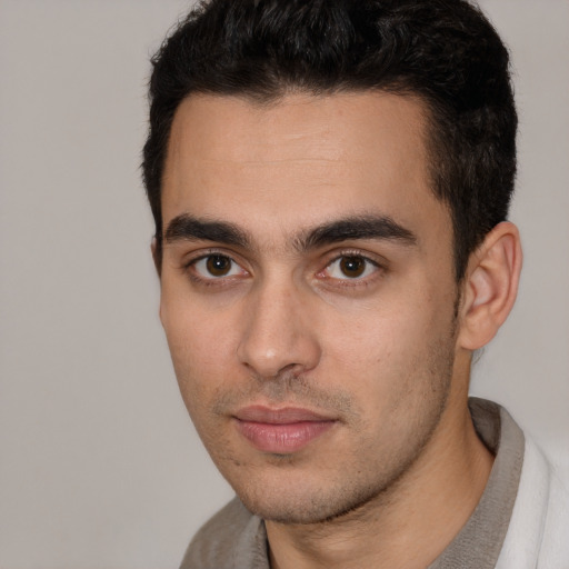 Neutral white young-adult male with short  black hair and brown eyes