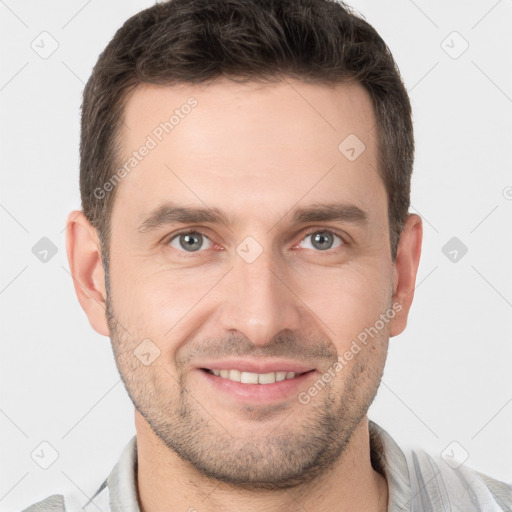 Joyful white young-adult male with short  brown hair and brown eyes