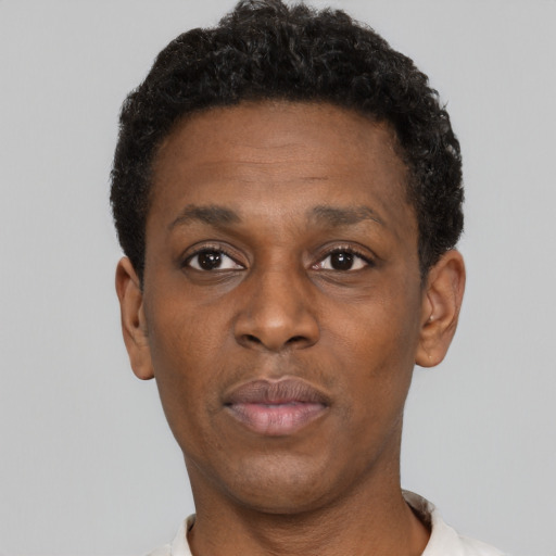 Neutral black adult male with short  black hair and brown eyes