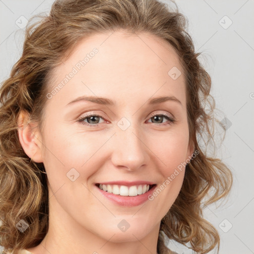 Joyful white young-adult female with medium  brown hair and blue eyes