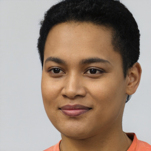 Joyful latino young-adult female with short  black hair and brown eyes