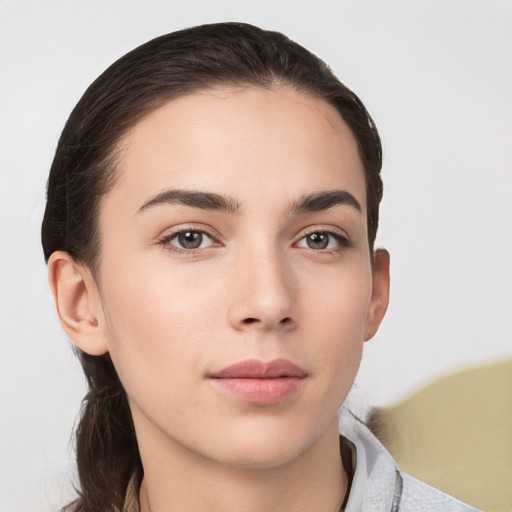 Neutral white young-adult female with medium  brown hair and brown eyes