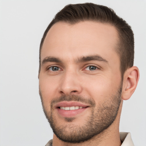 Joyful white young-adult male with short  brown hair and brown eyes