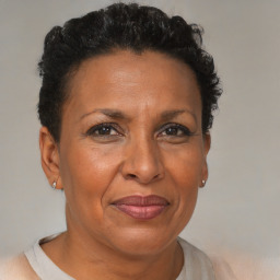 Joyful black adult female with short  brown hair and brown eyes