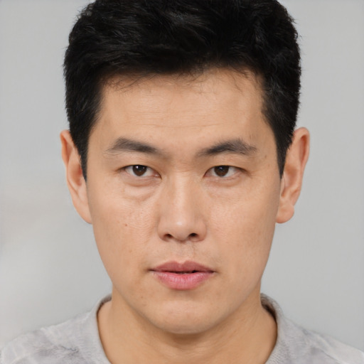 Neutral asian young-adult male with short  black hair and brown eyes