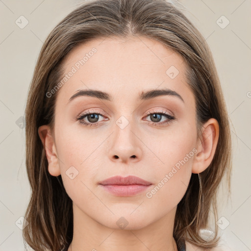 Neutral white young-adult female with medium  brown hair and grey eyes