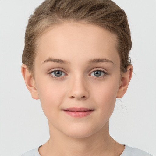 Joyful white child female with short  brown hair and grey eyes