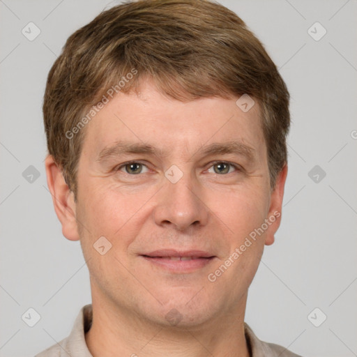 Joyful white adult male with short  brown hair and grey eyes