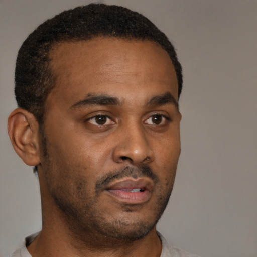 Neutral black young-adult male with short  brown hair and brown eyes