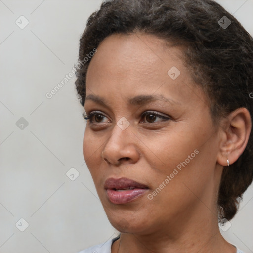 Neutral black young-adult female with short  brown hair and brown eyes