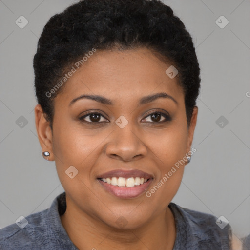 Joyful black young-adult female with short  brown hair and brown eyes