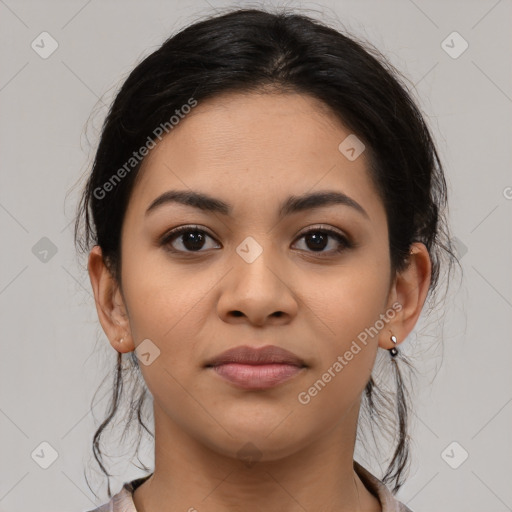 Joyful latino young-adult female with medium  brown hair and brown eyes