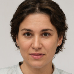 Joyful white adult female with short  brown hair and brown eyes