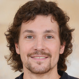 Joyful white young-adult male with medium  brown hair and brown eyes