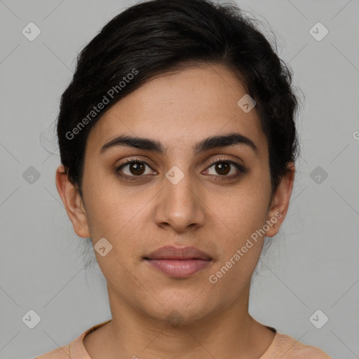 Joyful latino young-adult female with short  brown hair and brown eyes