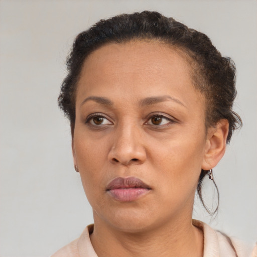 Neutral black adult female with short  brown hair and brown eyes