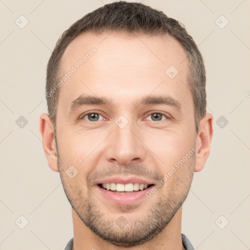 Joyful white young-adult male with short  brown hair and brown eyes