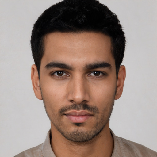 Neutral latino young-adult male with short  black hair and brown eyes