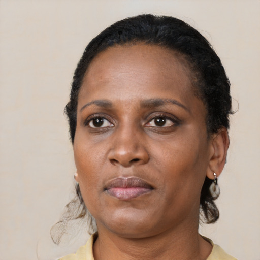 Neutral black adult female with short  black hair and brown eyes
