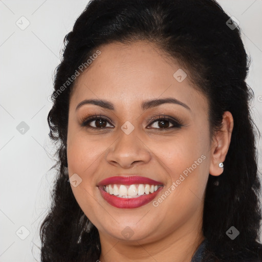 Joyful black young-adult female with long  brown hair and brown eyes