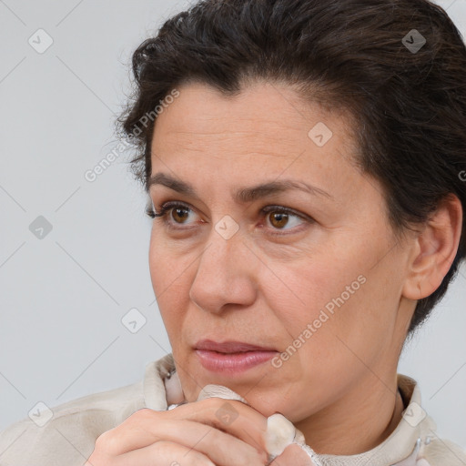 Joyful white adult female with short  brown hair and brown eyes