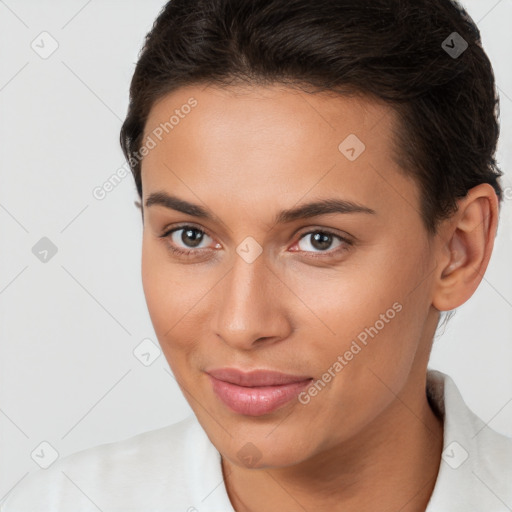 Joyful white young-adult female with short  brown hair and brown eyes