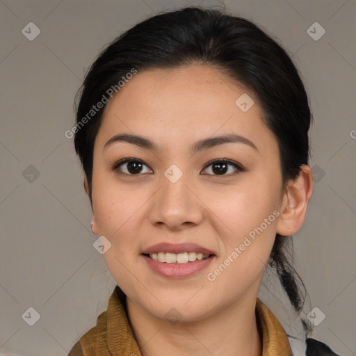 Joyful latino young-adult female with medium  brown hair and brown eyes