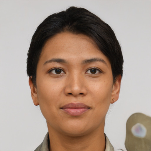 Joyful asian young-adult female with short  brown hair and brown eyes