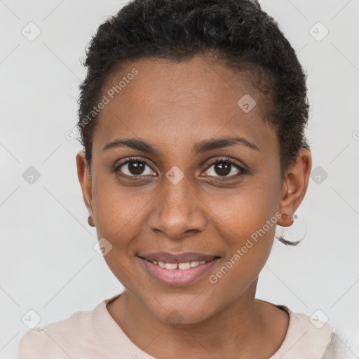 Joyful black young-adult female with short  brown hair and brown eyes