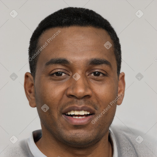 Joyful black young-adult male with short  black hair and brown eyes