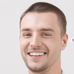 Joyful white young-adult male with short  brown hair and grey eyes