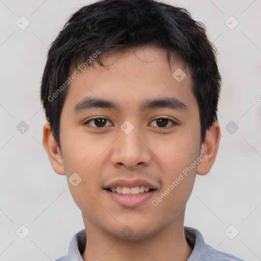 Joyful asian young-adult male with short  brown hair and brown eyes