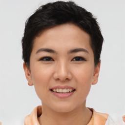 Joyful asian young-adult female with short  brown hair and brown eyes