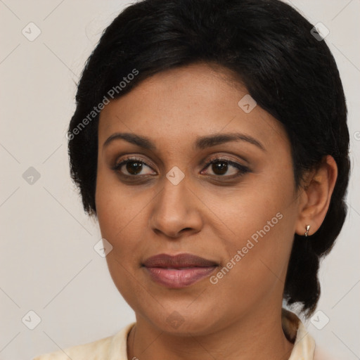 Joyful latino young-adult female with medium  brown hair and brown eyes