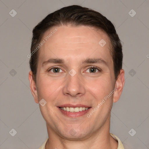 Joyful white adult male with short  brown hair and grey eyes