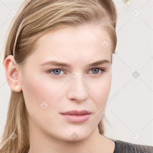 Neutral white young-adult female with long  brown hair and grey eyes