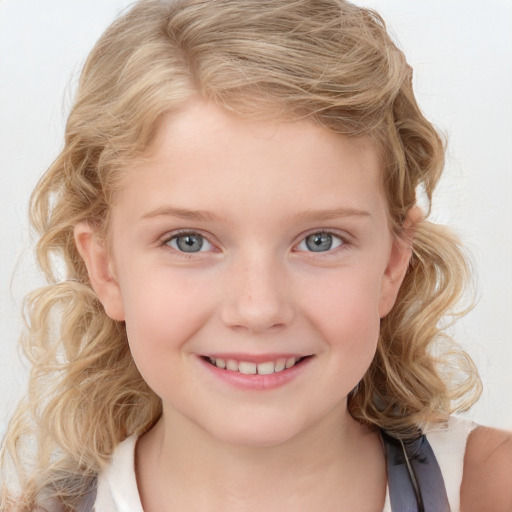 Joyful white child female with medium  blond hair and blue eyes