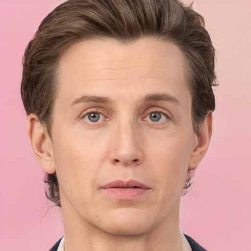 Joyful white adult male with medium  brown hair and grey eyes