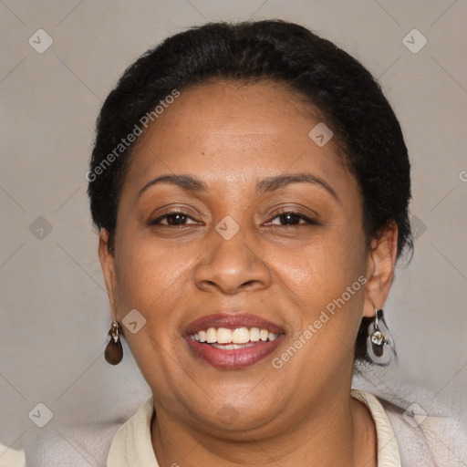 Joyful latino adult female with short  brown hair and brown eyes